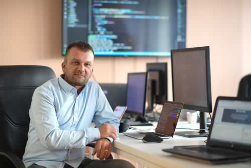 IT manager sitting at desk