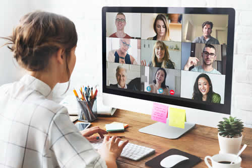 Young woman attending a remote team meeting