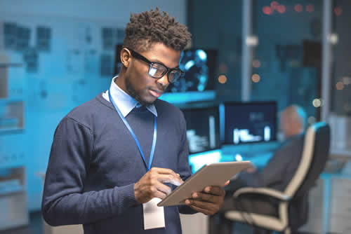 IT worker looking at security report