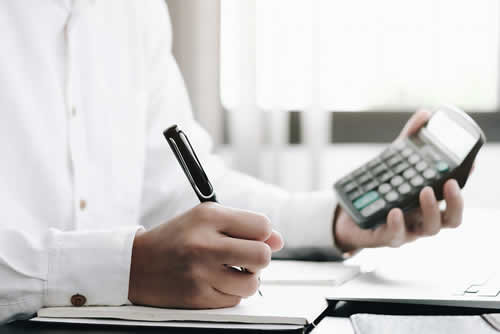 Accountant working out balance sheet ratios