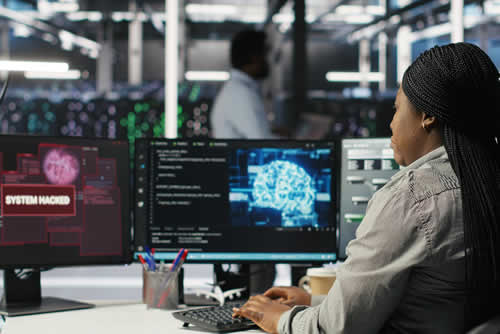 IT worker watching cyber reports