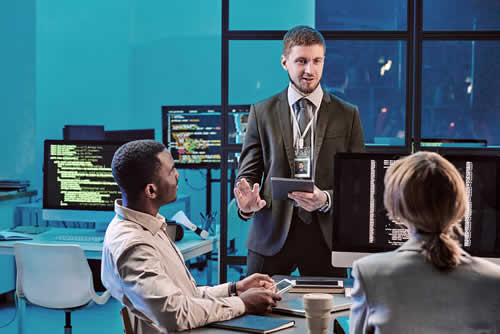 IT manager training his team on best practices