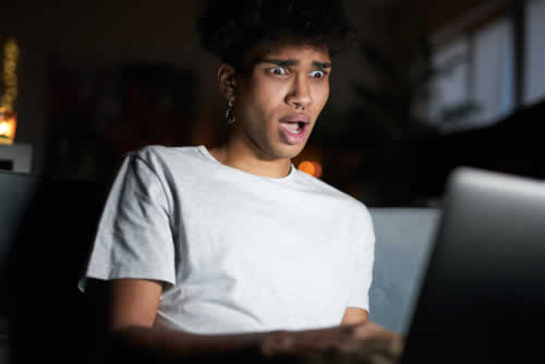 Young person looking at harmful content