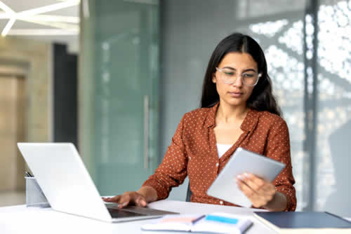 Teacher inspecting online student reports