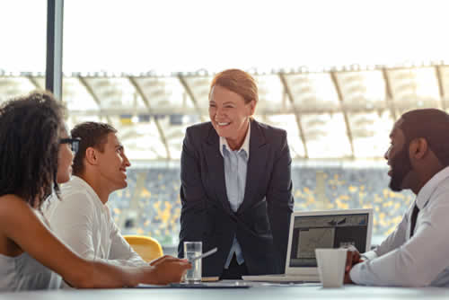 Manager in meeting talking to staff