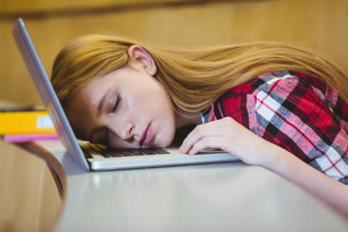 Student tired after looking at long blocks of text
