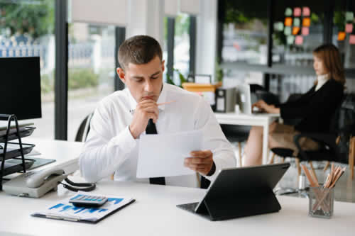 Manager looking at training report