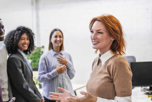 Happy team having a conversation