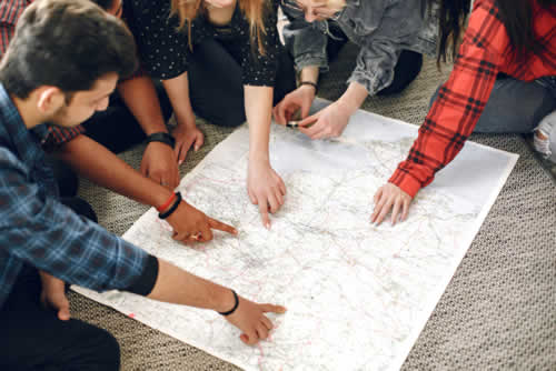 Team looking at local field territory map