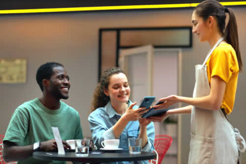 Waitress taking payment