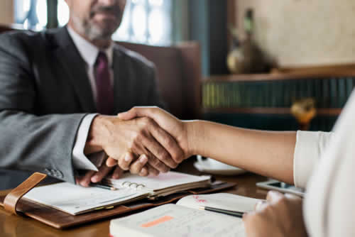 Handshake after a successful marketing strategy meeting