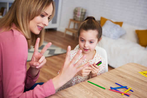 Child talking to adult about numbers