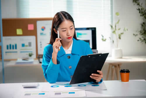 Marketing consultant looking at action points