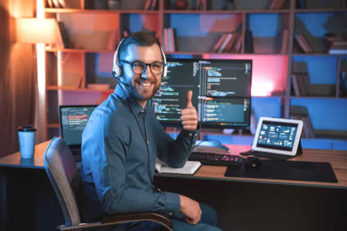 Happy software engineer giving a thumbs up