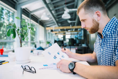 Project manager viewing progress reports