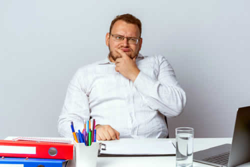 Doubtful office worker showing disbelief