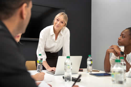 Manager asking a question to a member of their team