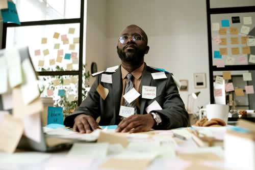 Busy manager organizing operations