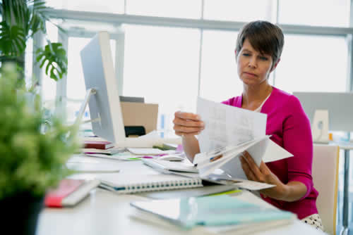 Voluntary worker looking at accounts data