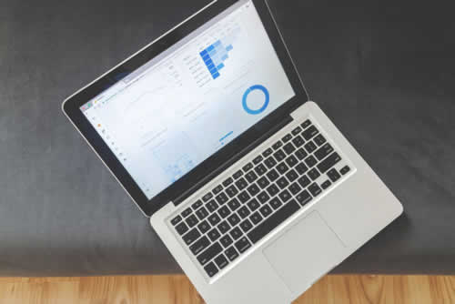 Laptop showing market research report