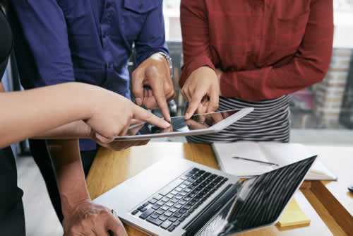 Project management team sharing a report