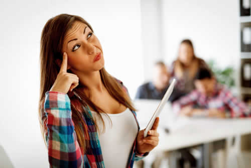 Confused student looking at assignment