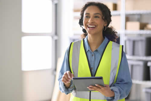 Field service engineer logging details on a tablet