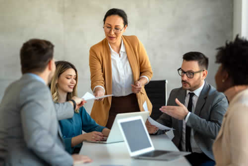 Manager in meeting with diverse team